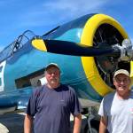 John Johnson and Dave Richardson stand next to Johns T-6 Texan that he and Richardson will travel with on a Naval aircraft to Hawaii and fly to commemorate the end of World War II 75 years ago. Photo courtesy of Dave Richardson