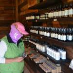 Shari Roland of Tacoma looks at some soaps during a visit to Lavender Connections gift shop. Lavender farms must require visitors and staff to wear masks inside buildings and recommend them in lavender fields, Clallam County health officials say. Sequim Gazette photo by Matthew Nash