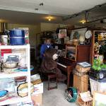 Carol Labee organizes items at the site of the Sequim Guild of Seattle Childrens Hospitals 13th-annual Garage & Plant Sale, set for July 24-25. Submitted photo