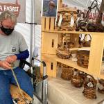 Greg Gundy of Sea Basket Farm is busy at work this past weekend at the Sequim Farmers & Artisans Market. Photo by Emma Jane Garcia