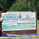 Annette Hanson, capital campaign committee chair for the expansion of the Dungeness River Audubon Center, and W. Ron Allen, tribal chairman for the Jamestown SKlallam Tribe, reveal a new sign in June 2018 at the entrance to the Railroad Bridge Park announcing the campaign to build a new parking lot and expand the center. Construction is anticipated to begin in August 2020 and completed by summer 2021. Sequim Gazette file photo by Matthew Nash
