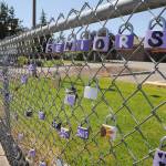 Padlocks celebrating Sequim High Schools Class of 2020 line the chain-link fence near the school on North Sequim Avenue this week. School district officials are contemplating reopening the school campuses for classes in the fall. Sequim Gazette photo by Michael Dashiell