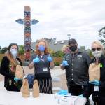 Greeting people at the Sequim Civic Center earlier this month with free brown bag lunches and masks are, from left: Samantha Troxler, OlyCAP housing services and operations manager; Alyson McWilliams, PATH (Projects for Assistance in Transition from Homelessness) case manager; and PATHfinders Alan Austin and Sandra Allen. Sequim Gazette photo by Michael Dashiell