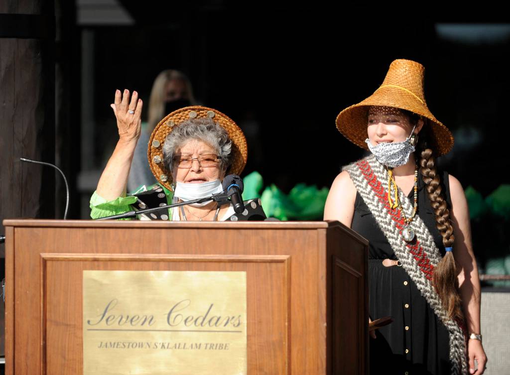 Tribal elder Elaine Grinnell, left, and her granddaughter, tribal council member Loni Greninger, sing a paddling song at the grand opening/ribbon-cutting of the Jamestown SKlallam Tribes 7 Cedars Hotel on Aug. 4. Sequim Gazette photo by Michael Dashiell