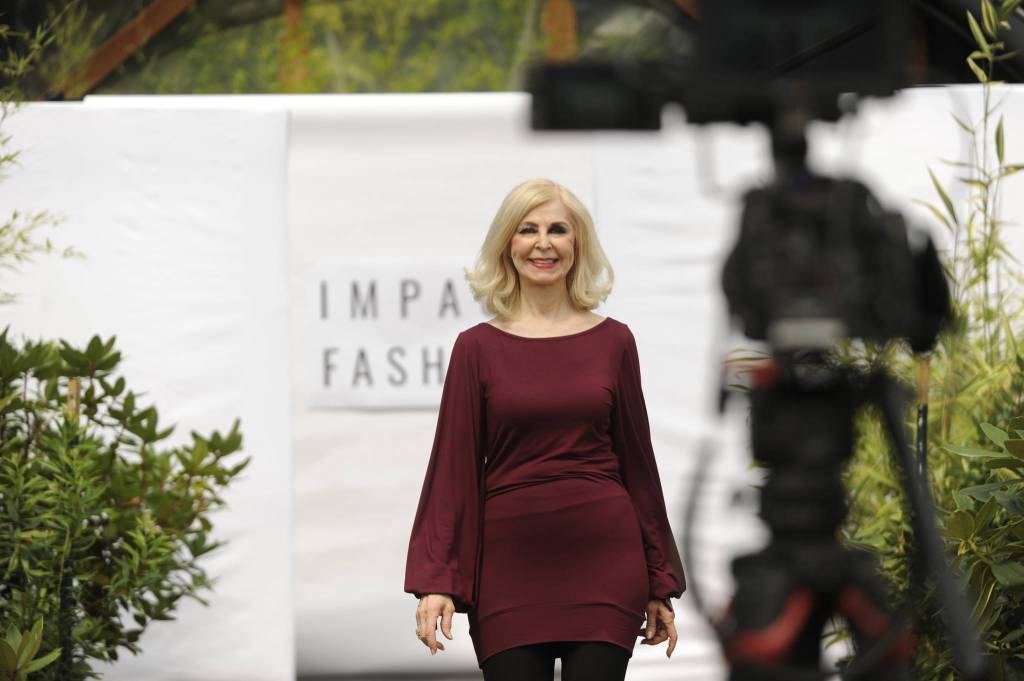 Cherie Kidd of Port Angeles walks the runway for Impact Fashion on Aug. 6 promoting sustainable fashions. Kidd said shes intrigued by the nonprofit creator Sica Schmitzs message and believes she created a wonderful effort that so many people believe in. Sequim Gazette photo by Matthew Nash