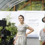 Sarah Shea of Sequim walks the runway to promote sustainable clothing lines through Impact Fashion. Photographers and videographers like Cindy Roth, right, will help compile footage and photos for the Sept. 4 debut of the fashion show as part of a two-day summit.