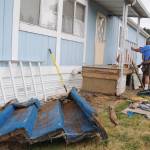 Members of the Sequim Valley Lions Club help fix Lori Bittick-Humbers front porch in Carlsborg on Aug. 10. Sequim Gazette photos by Michael Dashiell