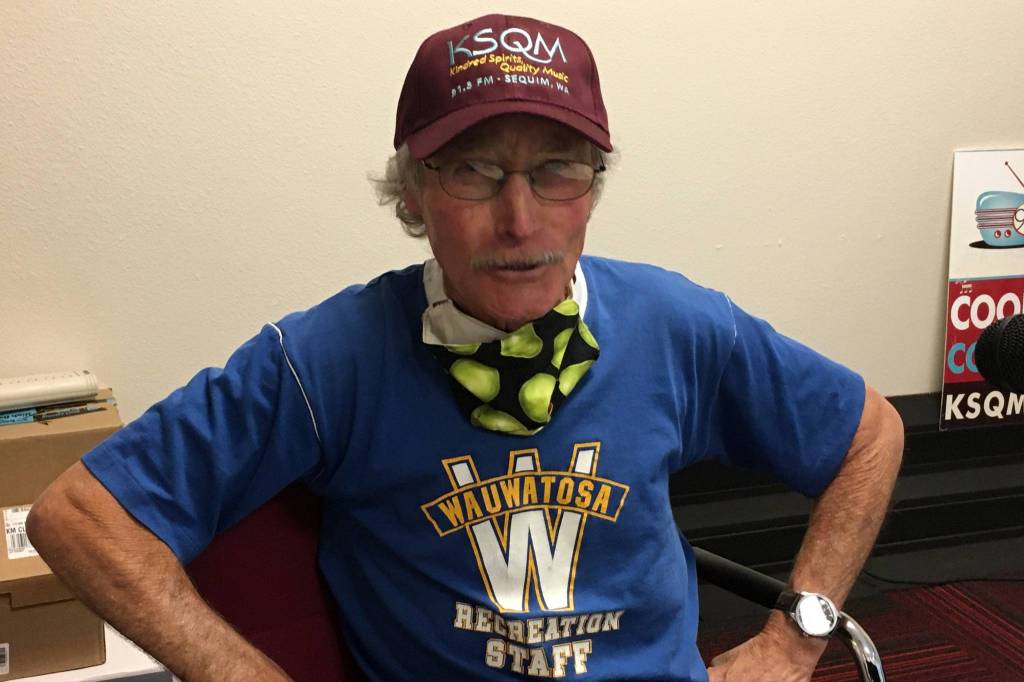 Ciscoe Morris was presented a KSQM 91.5 FM hat on Saturday by Susan Sorensen after his first show of Gardening with Ciscoe. Sequim Gazette photo by Matthew Nash