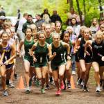 Runners from Sequim, Port Angeles and North Kitsap girls cross country squads break from the starting line at Robin Hill County Park at an Olympic League meet in 2019. All of the Olympic Leagues 2020 fall sports  including cross country  have been moved to spring 2021. Sequim Gazette file photo by Michael Dashiell