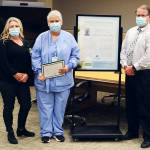 Celebrating Olympic Medical Center nurse Ardith Schuchardt, third from left, for her DAISY Award for Extraordinary Nurses honor are, from left: Sandra McGoldrick, clinical supervisor-obstetrics; Chris Johnson, director of obstetrics and new family services, and OMC chief nursing officer Ralph Parker. Photo courtesy of Olympic Medical Center