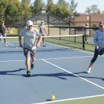 Is it in? Roger Gonzales and Laurie McColl see a lob shot land  and lose a point  to Sue Haus and John Herbold in pickleball play at Carrie Blake Community Park on Aug. 14. Sequim Gazette photo by Michael Dashiell