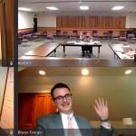 Andrew Reeves, Clallam County hearing examiner, top left, swears in participants for a remand hearing on July 16 for the proposed Carlsborg manufactured home park by Chris Anderson, bottom left. Reeves approved the project on Aug. 19. Sequim Gazette photo by Matthew Nash