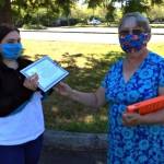 Fourteen-year-old Allison Broadwell of Port Angeles receives a certificate and an Amazon Fire tablet from Philomena Lund, chairperson for the Clallam County Literacy Councils writing contest.