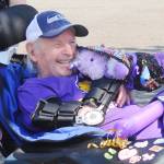 Myron Teterud, a longtime Sequim High sports fan, enjoys some gifts from Sequim Alumni Association members and friends on Sept. 8. Sequim Gazette photo by Michael Dashiell