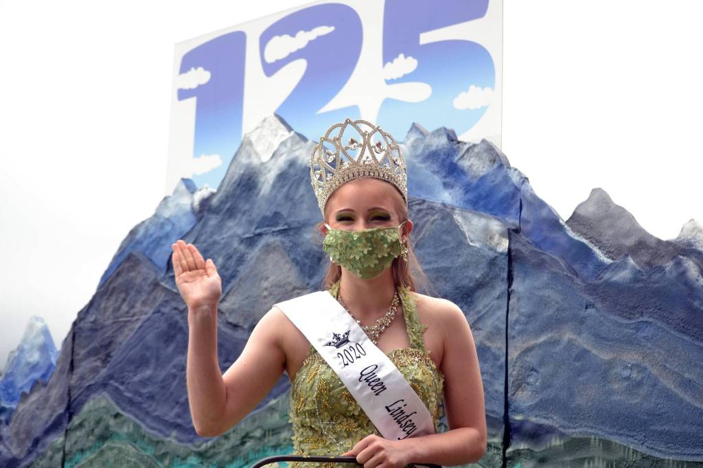 Queen Lindsey Coffman waves for the first time from the Sequim Irrigation Festivals float on Sept. 19.