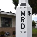 Woodworker Ron DeGroat dedicated his wooden rocket to his late son Michael Ross DeGroat. He calls the model a tribute to his son. Sequim Gazette photo by Matthew Nash