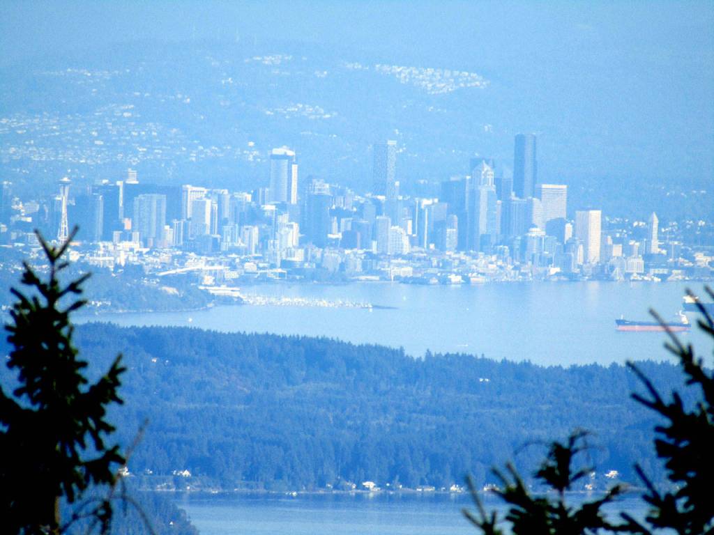 Downtown Seattle appears through the trees from Mount Walkers south viewpoint Sunday, Sept. 20. Photo by Rob Ollikainen/Olympic Peninsula News Group