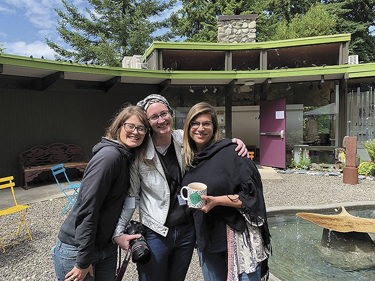 The Port Angeles Fine Arts Center staff  from left, community outreach coordinator Lauren Bailey, gallery/program director Sarah Jane and executive director Jessica Elliott  enjoy the 2019 Summertide Festival. Photo courtesy of Port Angeles Fine Arts Center
