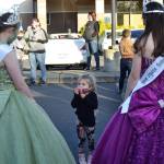 Four-year-old Mavery Abken chats with Sequim Irrigation Festival royalty before the procession on Oct. 10. Sequim Gazette photo by Matthew Nash