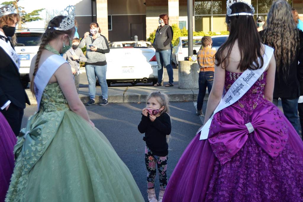Four-year-old Mavery Abken chats with Sequim Irrigation Festival royalty before the procession on Oct. 10. Sequim Gazette photo by Matthew Nash