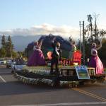 The Sequim Irrigation Festival float takes the corner of North Priest Road and Hendrickson Road during its procession on Oct. 10. Sequim Gazette photo by Matthew Nash