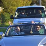 Grand Pioneer Walter Grant with Marcus Oden wave during the procession of the Sequim Irrigation Festival on Oct. 10. Sequim Gazette photo by Matthew Nash
