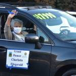 Grand Pioneer Charlotte Fitzgerald waves as she rides along Washington Street on Oct. 10 during the Sequim Irrigation Festivals procession. Sequim Gazette photo by Matthew Nash