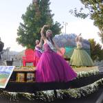 Royalty (from left) prince Logan Laxson, princess Brii Hingtgen, princess Alicia Pairadee and queen Lindsey Coffman wave to a virtual crowd on Sequim-Dungeness Way during the Sequim Irrigation Festival's makeshift Grand Parade on Saturday, Oct. 10. Sequim Gazette photo by Michael Dashiell