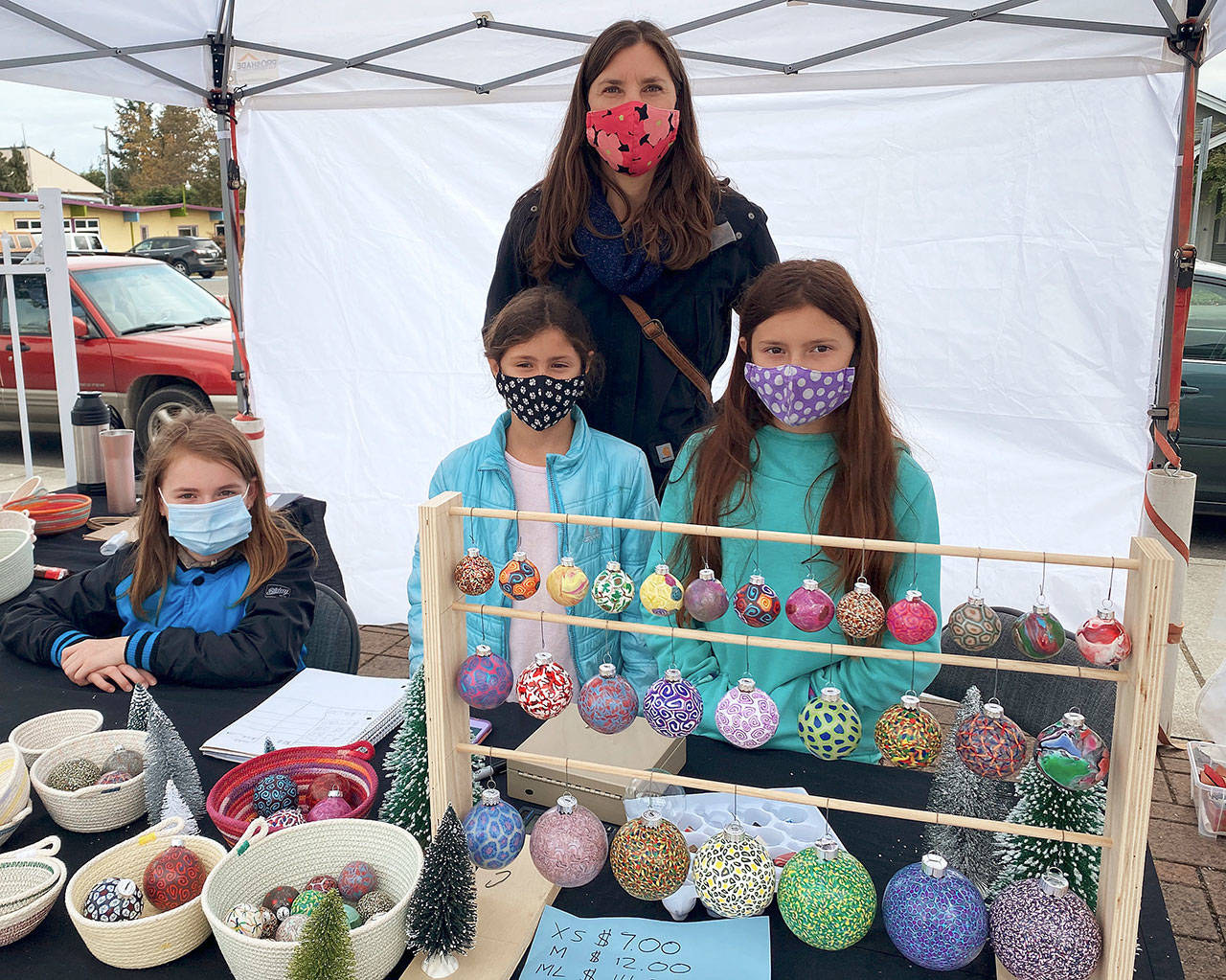 Above: Check out special holiday ornaments in a variety of designs and patterns from Fenkai Designs at the Sequim Farmers & Artisans Market this weekend. Below: Michel McCarters Madrona Ridge Pottery creations are available at the Sequim Farmers & Artisans Market through October. Photos by Emma Jane Garcia