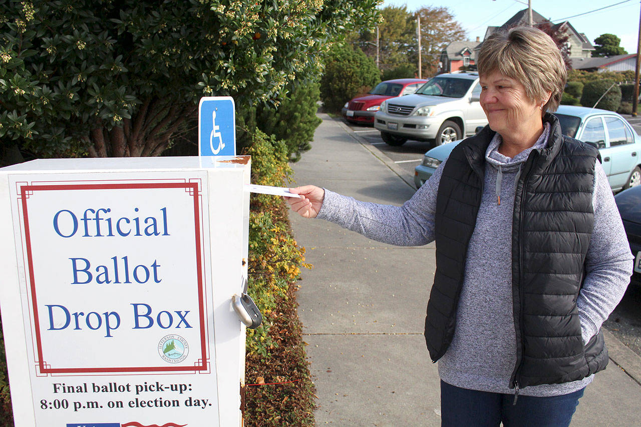 Cindy Rice of Port Ludlow drops off her ballot for the Nov. 3 general election on Thursday at the walk-up drop box in front of the Jefferson County Courthouse, 1820 Jefferson St. (Zach Jablonski/Peninsula Daily News)