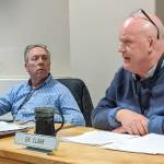 Sequim School District superintendent Rob Clark, right, discusses terms of his contract extension with the school board while board president Brandino Gibson listens on during a school board meeting in January. Clark on leave as of Oct. 22 pending the outcome of a complaint, school district officials said this week. Sequim Gazette file photo by Conor Dowley