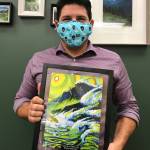 Tyler Johnson displays his United Way of Clallam County Live United award that features the artwork of Todd Fischer.The 2019 campaign chair, Johnson went above and beyond to help United Way reach the campaign goal, the organization said last week. Submitted photo