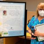 Olympic Medical Center nurse Dolores Dee Cantlon receives a DAISY Award, an honor that recognizes extraordinary compassionate care provided to patients and families. Submitted photo