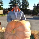 Ross Osborn brought his giant pumpkin to JACE Real Estate Company to share with people for Halloween. Visitors can guess its weight and/or post selfies to JACEs social media page for a chance to win local gift certificates. Sequim Gazette photo by Matthew Nash