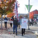 Above: Tim Wheeler, left, and a group of about 40 individuals sing Woody Guthries This Land Is Your Land, accompanied by Steve Koehler on banjo. Left: Wheeler and Lisa Dekker help lead a group of about 40 individuals in a rally and walk in downtown Sequim on Nov. 4 to promote the counting of all ballots in the 2020 general election. Organized in part by Indivisible Sequim, the event was part of a nation-wide rally organized by Protect the Results, a coalition of more than 100 groups formed to protect the results of the election in the case that President Donald Trump refuses to concede. This is America; all our votes must count and be counted, said Elizabeth Schilling, event co-organizer. Sequim Gazette photo by Michael Dashiell