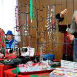 Barbara Tabor, left, and Janet McColl display items at the vintage/costume jewelry table at the Sequim Guild of Seattle Childrens Hospitals Holiday Bazaar in 2019. This years event is set for Saturday, Nov. 21. Submitted photo