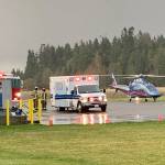 Fire District 3 and medical personnel prepare at Sequim Valley Airport to assist a person injured in a vehicle collision at U.S. Highway 101/Carlsborg Road on Nov. 13. Photo by Andy Sallee