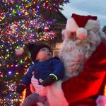 Magic moments like this between Dylan Krashan and Santa Claus in 2018 wont happen this year at the downtown Sequim tree lighting event due to pandemic protocols coming into place. The tree lighting moves online to 5 p.m. on Thanksgiving at the Sequim-Dungeness Valley Chamber of Commerces website and social media pages. Sequim Gazette file photo by Erin Hawkins
