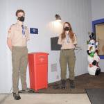 Sam Stewart and Jenna Mason of BSA Troop 1498 last week display a newly-installed flag retirement box at the Sequim Elks Lodge, 143 Port Williams Road. Worn and weathered flags can be deposited here, where scouts will collect them and dispose of them properly. Sequim Gazette photo by Michael Dashiell