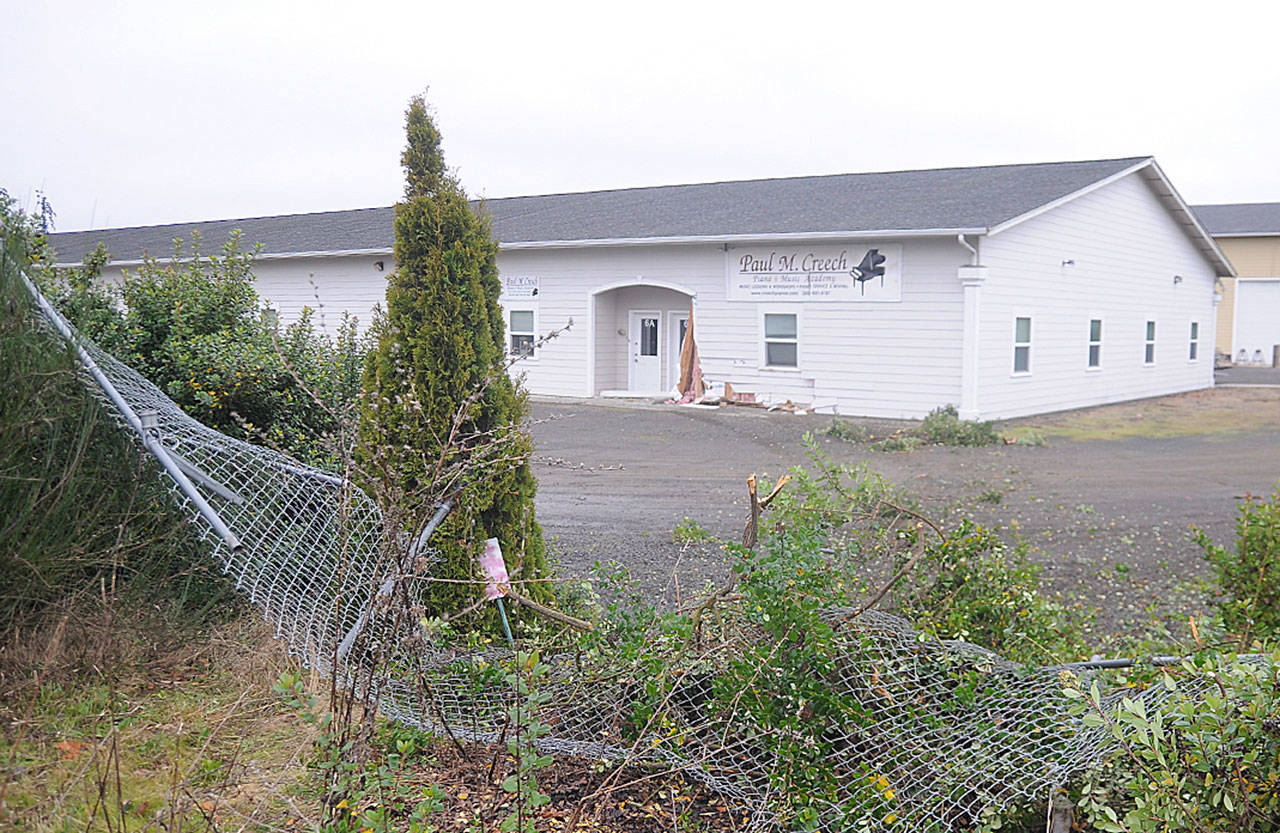 Paul Creechs Piano & Music Academy building shows the damage after a vehicle reportedly struck the structure on Dec. 2. An 18-year-old Sequim man was arrested following the incident. Sequim Gazette photo by Michael Dashiell