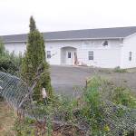 Paul Creechs Piano & Music Academy building shows the damage after a vehicle reportedly struck the structure on Dec. 2. An 18-year-old Sequim man was arrested following the incident. Sequim Gazette photo by Michael Dashiell