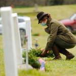 Lance Cpl. Holly Rowan, a U.S. Marine Corps veteran, lays a ceremonial wreath at Saturdays Wreaths Across America event at Sequim View Cemetery. Sequim Gazette photo by Michael Dashiell