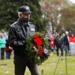 At Saturdays Wreaths Across America event at Sequim View Cemetery, Col. Randy Roberts (U.S. Air Force, ret.) prepares to lay a ceremonial wreath for U.S. military prisoners of war and missing in action. Sequim Gazette photo by Michael Dashiell