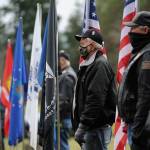 Members of the Clallam County Legion Riders Post 29 create a flag line as a patriotic backdrop to the Wreaths Across America event held Dec. 19 at Sequim View Cemetery. Sequim Gazette photo by Michael Dashiell