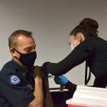 Nurse Kelly Bower with the Jamestown Family Health Clinic gives a Moderna COVID-19 Vaccine to Capt. Derrell Sharp with Clallam County Fire District 3 on Dec. 29 at the fire stations headquarters. Clinic leaders say theyve begun circulating the vaccine to first responders and plan to offer community vaccinations in the coming weeks. Sequim Gazette photo by Matthew Nash