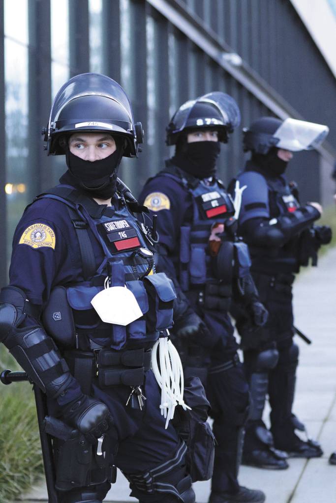 Security personnel watch over the Washington State Capitol campus on the opening day of the 2021 state legislature session. Security is being increased leading up to the Jan. 20 presidential inauguration, including members of the Washington State Patrol and National Guard. Photo by Roger Harnack/Cheney Free Press
