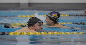 Sequim swimmers churn the waters at the Sequim YMCA last week in preparation for their upcoming, shortened season. Sequim Gazette photo by Michael Dashiell