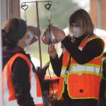 Nurse Charissa Decker prepares a vaccination shot at the Jamestown Family Health Clinic vaccination drive-thru clinic on Feb. 4. Sequim Gazette photo by Michael Dashiell