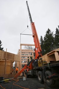 Crew workers with T&D Contracting last week set in place massive trusses as part of the expansion of the Dungeness River Audubon Center. Photo courtesy of Pete Nesse