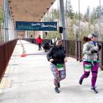 Brady Simis of Renton, left and Angela Smith of Buckley get started on their 10K runs at the Elwha Bridge Run Saturday morning. Photo by Pierre LaBossiere/Olympic Peninsula News Group